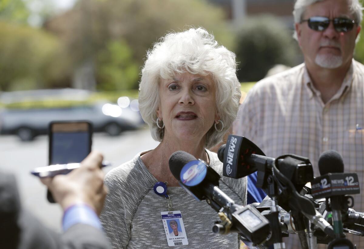 Wayne Community College President Kay Albertson speaks to members of the media following a shooting on campus in Goldsboro, N.C. One person was killed Monday in the shooting at the community college, which was locked down as authorities searched for a gunman, officials said.