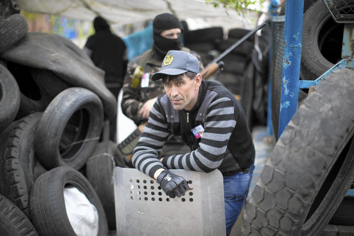 Pro-Russia activists guard barricades in Slovyansk, Ukraine.