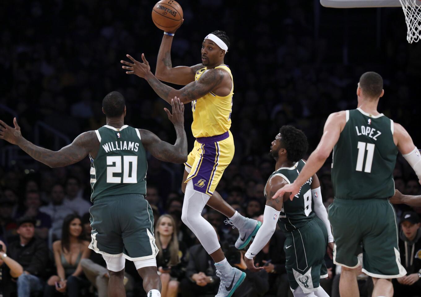 Lakers center Dwight Howard looks to pass during the first half of a game against the Bucks on March 6 at Staples Center.