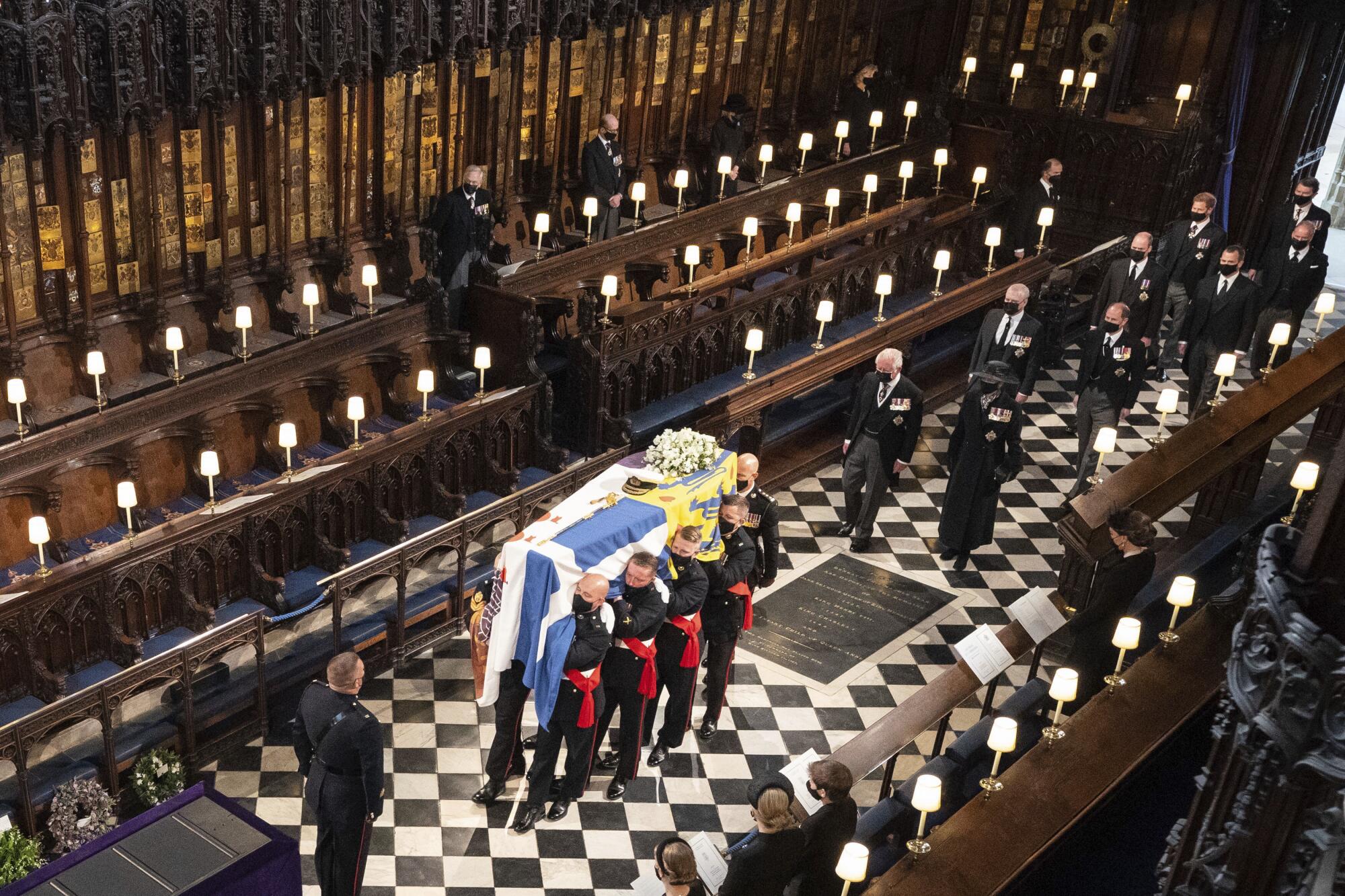 Pallbearers carry the coffin of Prince Philip inside St. George's Chapel.
