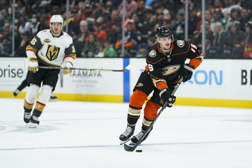 Anaheim Ducks' Troy Terry moves the puck during the second period of an NHL hockey game against the Vegas Golden Knights Wednesday, Dec. 1, 2021, in Anaheim, Calif. (AP Photo/Jae C. Hong)