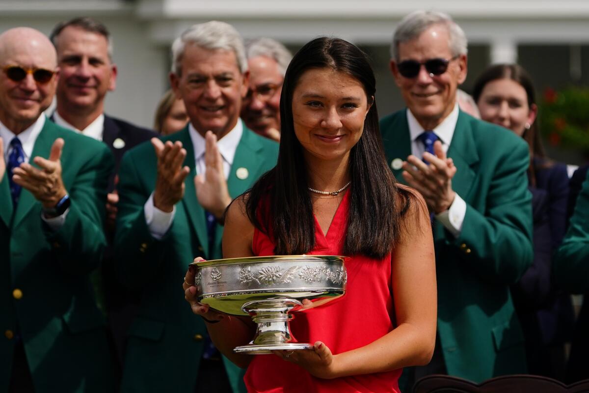 Anna Davis poses with the trophy after winning the Augusta National Women's Amateur.