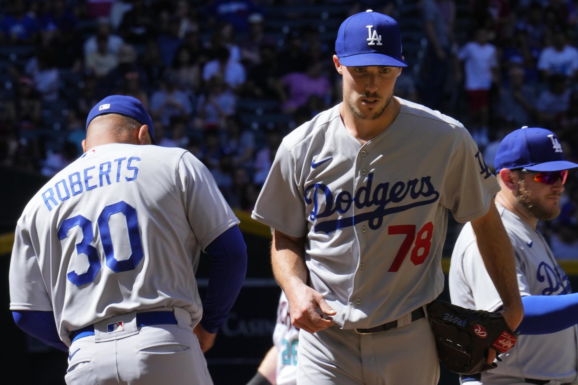 Dodgers starting pitcher Michael Grove is taken out of the game by manager Dave Roberts.