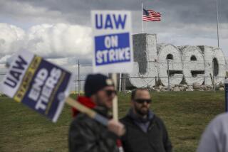 File - Striking UAW workers picket at the Jeep Assembly Plant on Oct. 9, 2023 in Toledo, Ohio. The UAW contends that the furloughs by Detroit's three automakers were not necessary and are being done in an effort to push members to accept less in contract negotiations. (Jonathan Aguilar/The Blade via AP, File)