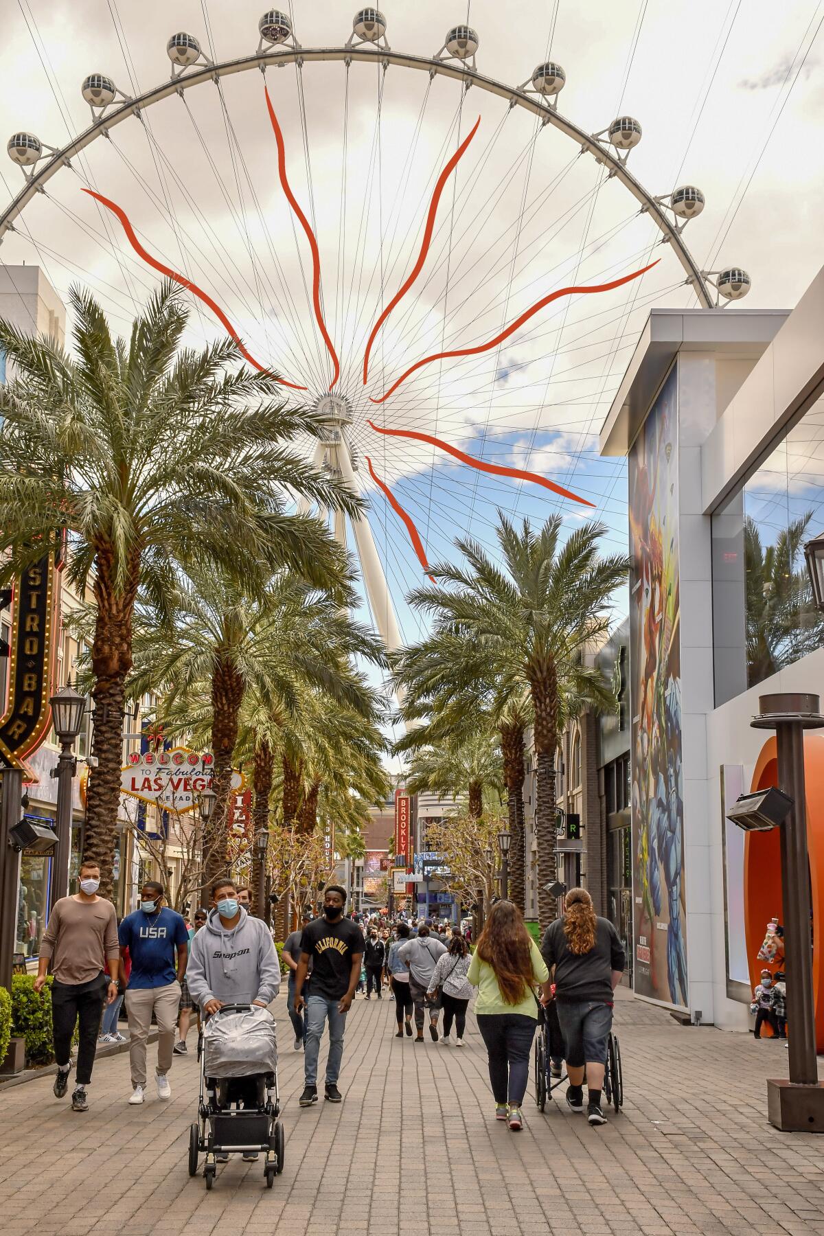 People walk along the Linq Promenade on the Las Vegas Strip 