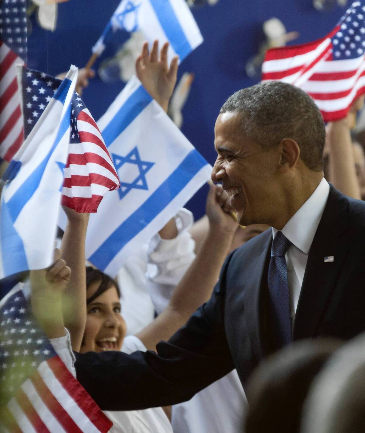 President Obama receives a welcome at the residence of Israeli President Shimon Peres in Jerusalem.
