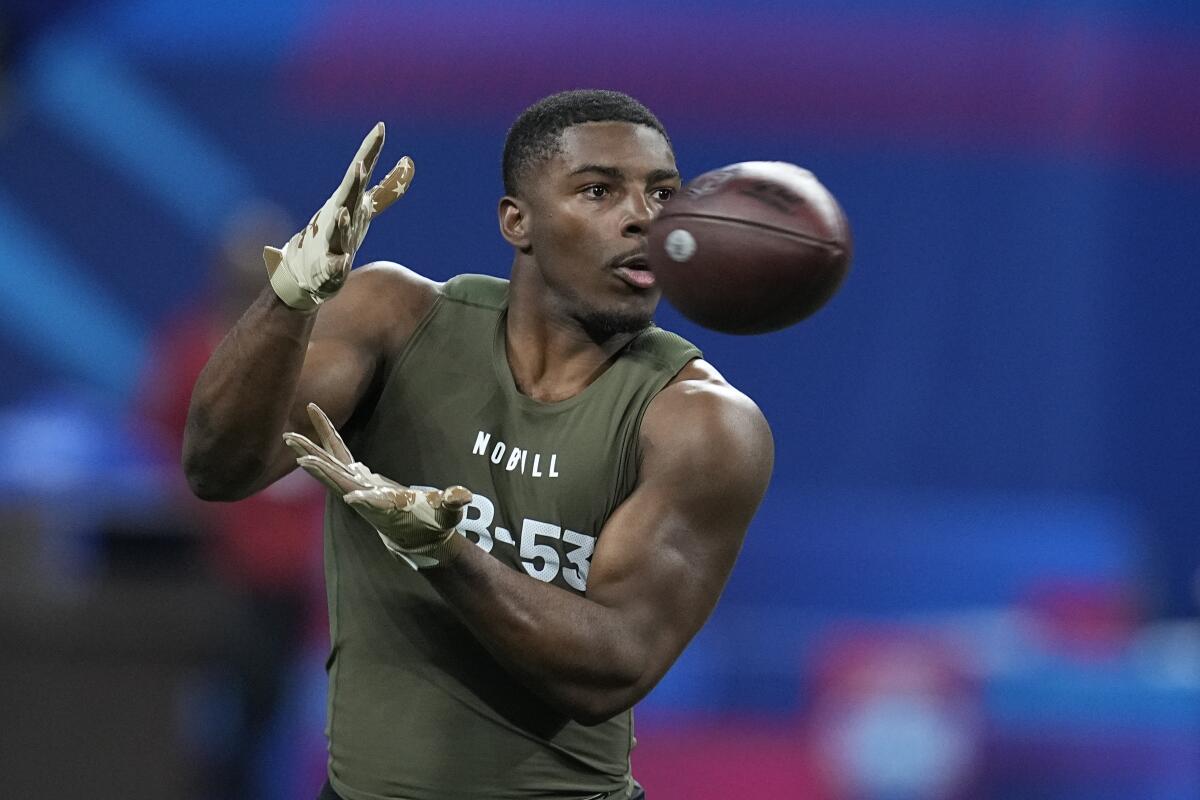 Miami defensive back Kamren Kinchens runs a drill at the NFL scouting combine on Friday.