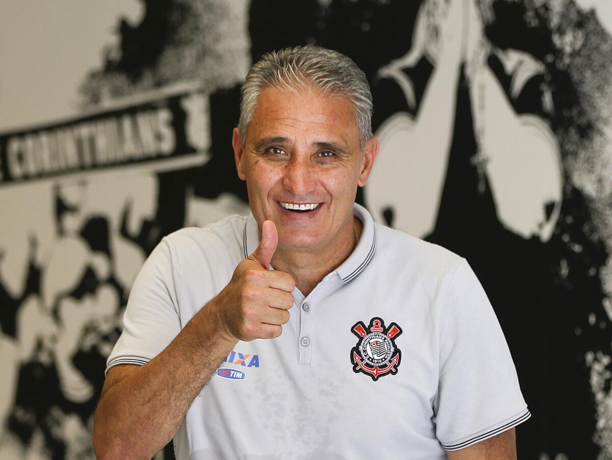 Corinthians Coach Adenor Leonardo Bacchi, known as Tite, flashes a thumbs up after a team training session in Sao Paulo, Brazil on Dec. 5, 2015.