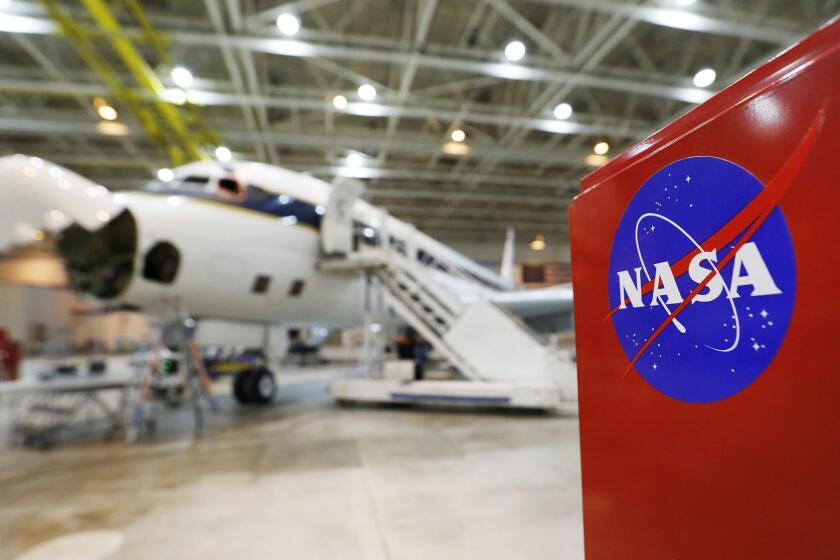 PALMDALE, CA - FEBRUARY 7, 2019 A NASA-operated DC-8 stationed in Palmdale California used to collect and analyze atmospheric samples from around the world in its hangar between missions on February 7, 2019. The plane can be loaded with cutting edge equipment and when running at full capacity, hosts roughly three dozen scientists and engineers, and a crew of eight, as it roams the planet. (Al Seib / Los Angeles Times)