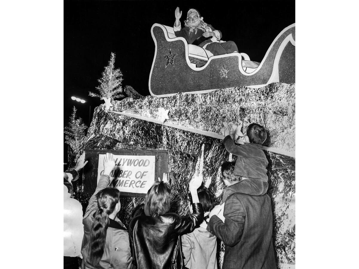 Nov. 23, 1960: Actor Burt Lange, as Santa, waves to the crowd during the Hollywood Santa Claus Lane Parade.
