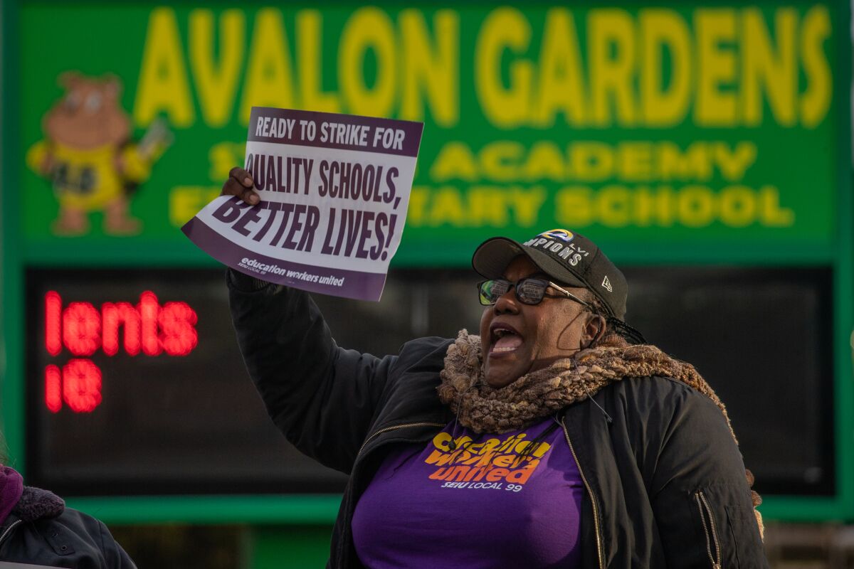 Vonita Rogers rallies on the last day of a scheduled three-day strike in front of Avalon Gardens Elementary School.