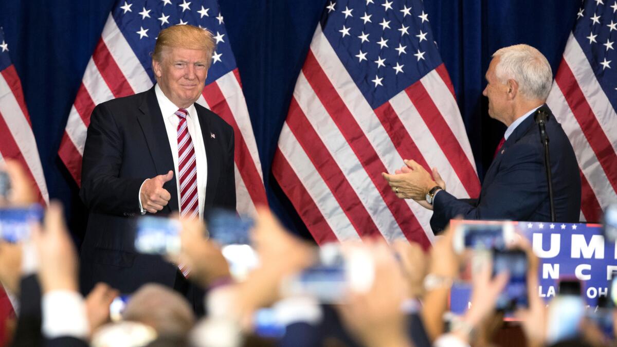 Republican nominee Donald Trump and running mate Indiana Gov. Mike Pence arrive for a goodbye reception with supporters Friday in Cleveland after the Republican National Convention.