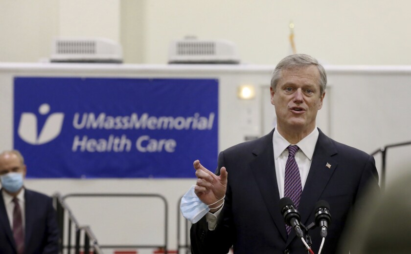 Gov. Charlie Baker speaks after touring the DCU Center as it gears up to be used as a COVID-19 field hospital for the second time on Thursday, Dec. 3, 2020 in Worcester, Mass. (Nancy Lane/The Boston Herald via AP, Pool)