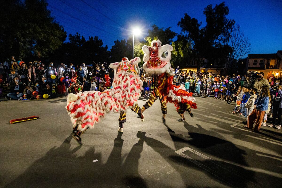 The Qing Wei Lion and Dragon Dance Cultural Troupe performs marking the last day of Lunar New Year