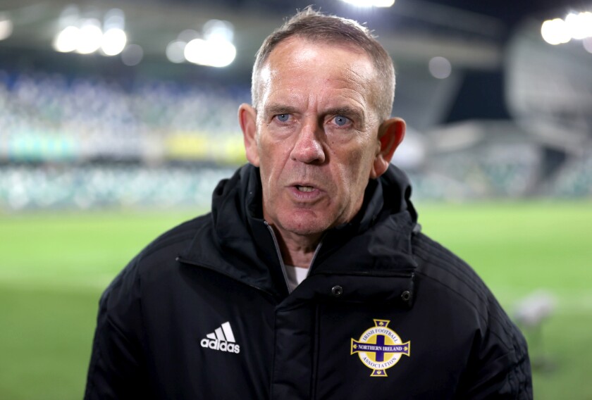 Northern Ireland manager Kenny Shiels speaks during a post match interview after the Women's World Cup Qualifying match between Northern Ireland and England, at Windsor Park, Belfast, Northern Ireland, Tuesday April 12, 2022. The coach of Northern Ireland’s women’s team has provoked criticism by saying girls and women were more susceptible to conceding multiple goals in a short space of time because they are “more emotional than men.” (Liam McBurney/PA via AP)