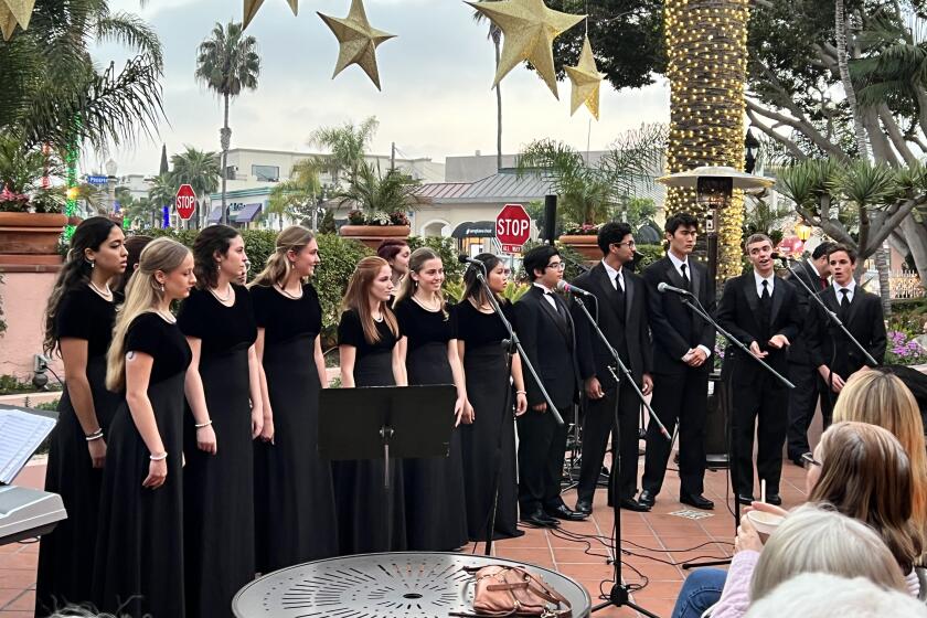 The La Jolla Country Day School Madrigal Singers performed Christmas carols at the La Valencia tree lighting Dec. 2.