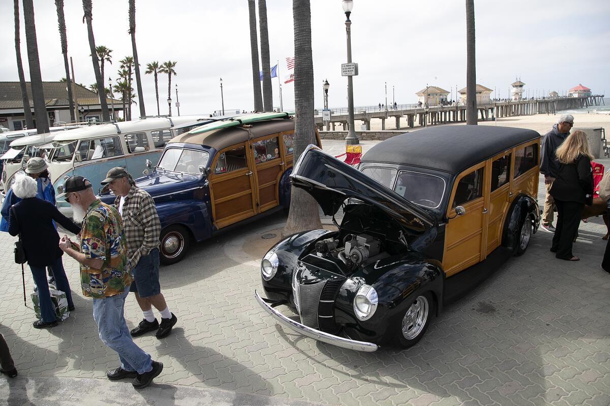 A black 1940 Ford Deluxe Woody Wagon at the 20th annual Beachcruisers event on Saturday in Huntington Beach.