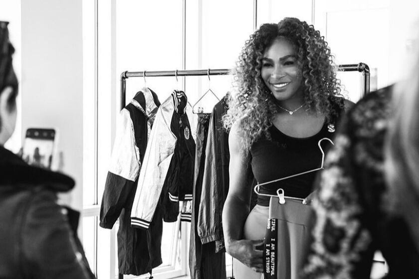 Serena Williams with clothes from her line.