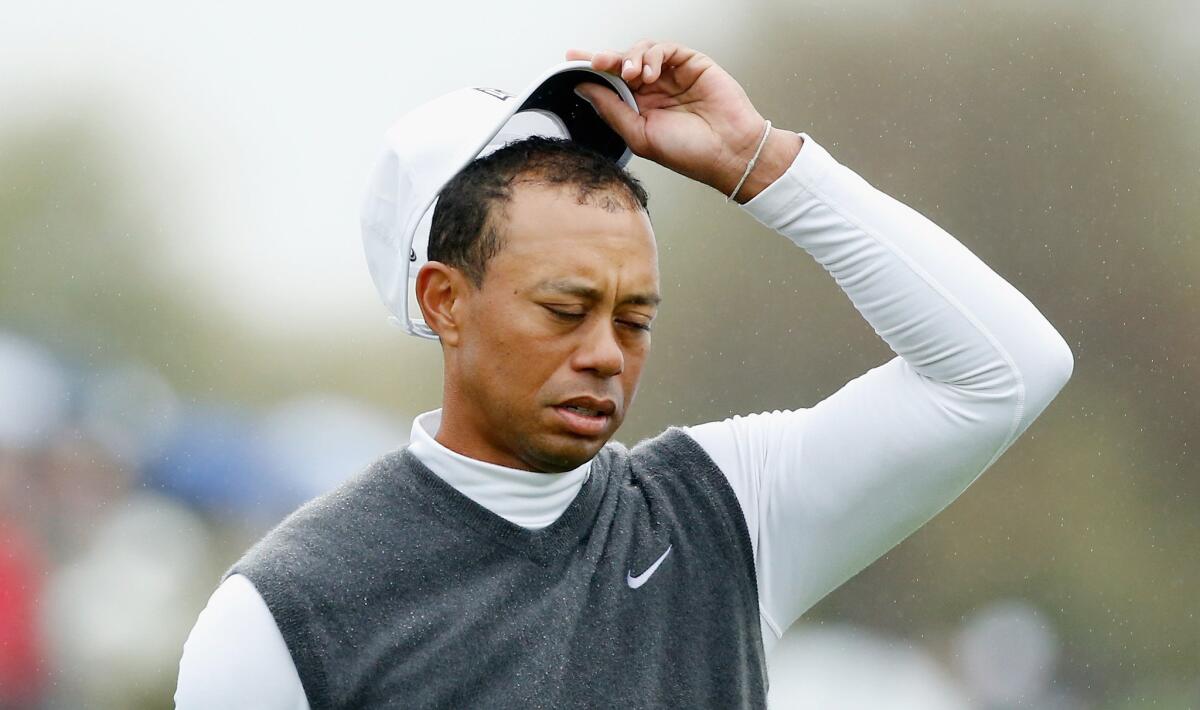 Tiger Woods removes his cap during the second round of the Waste Management Phoenix Open at TPC Scottsdale.