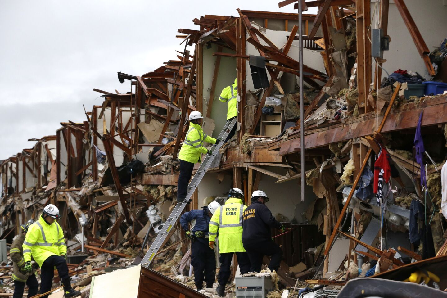 Firefighters conduct search and rescue of an apartment destroyed by an explosion at a fertilizer plant in West, Texas.