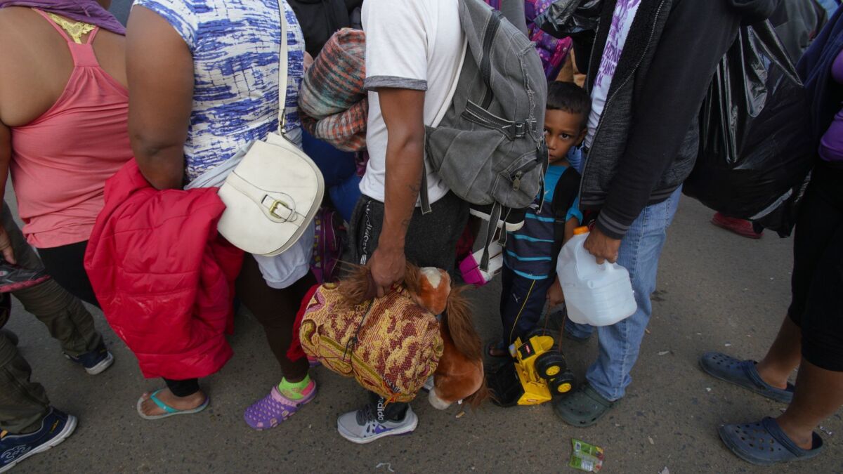 Migrants arrive from Mexicali to Tijuana. The group first went to the Benito Juarez Sports Complex which was originally used as the temporary shelter.