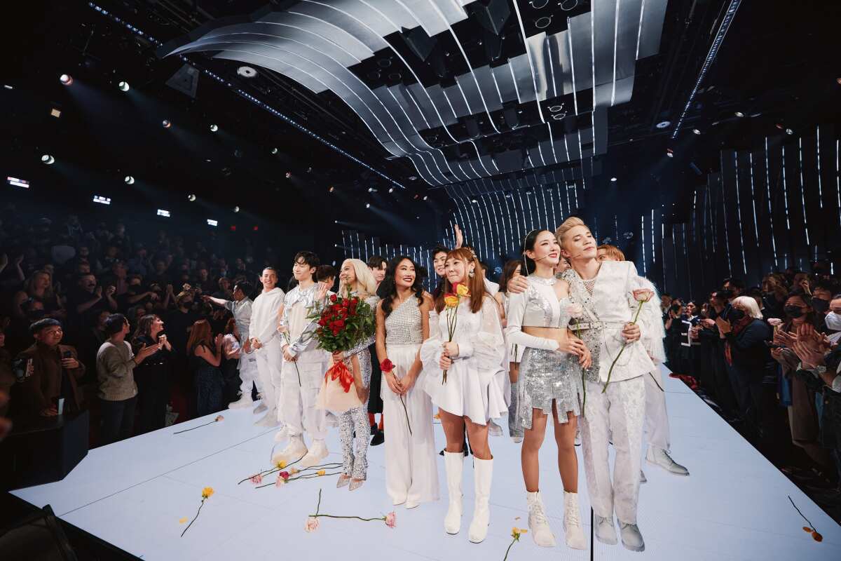 The cast of "KPOP" stands onstage.