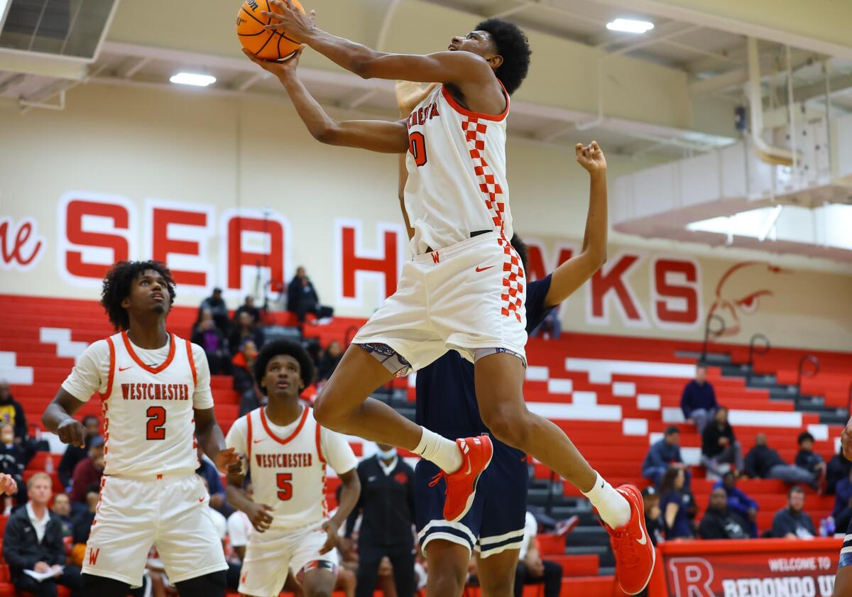 Tajh Ariza of Westchester goes airborne during a 74-72 win over Brentwood on Tuesday night.