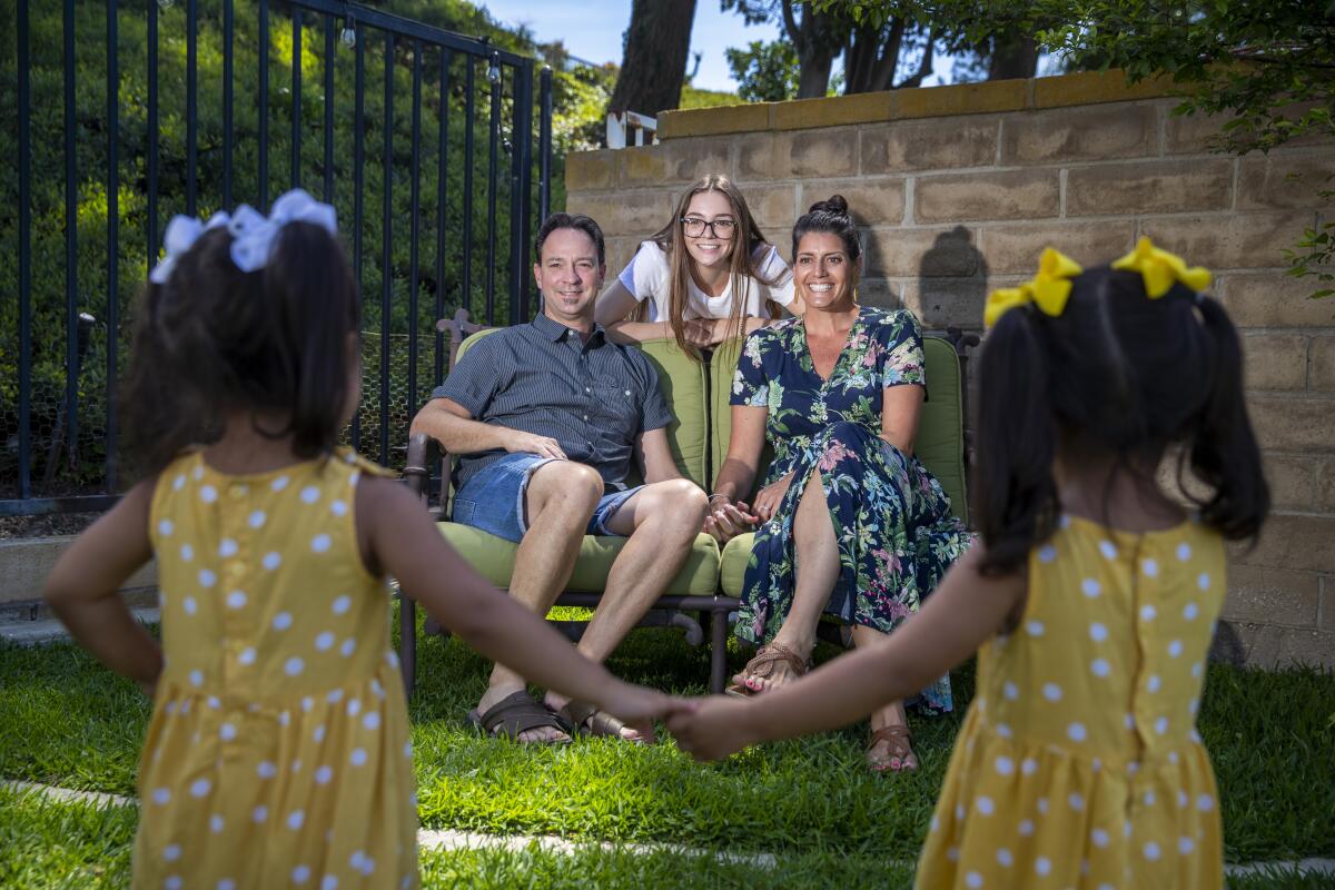 Natalia and Randall Bergman, with daughter Jessica, have been the foster parents of twin girls since they were 3 months old.