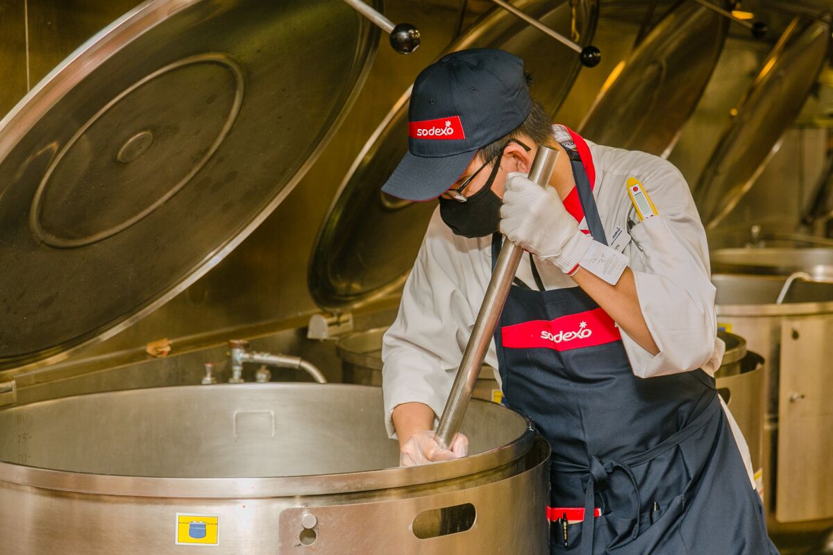 Kevin Tong, 39, stirs a giant vat of food in the mess hall kitchen at the Marine Corps Recruit Depot in San Diego.