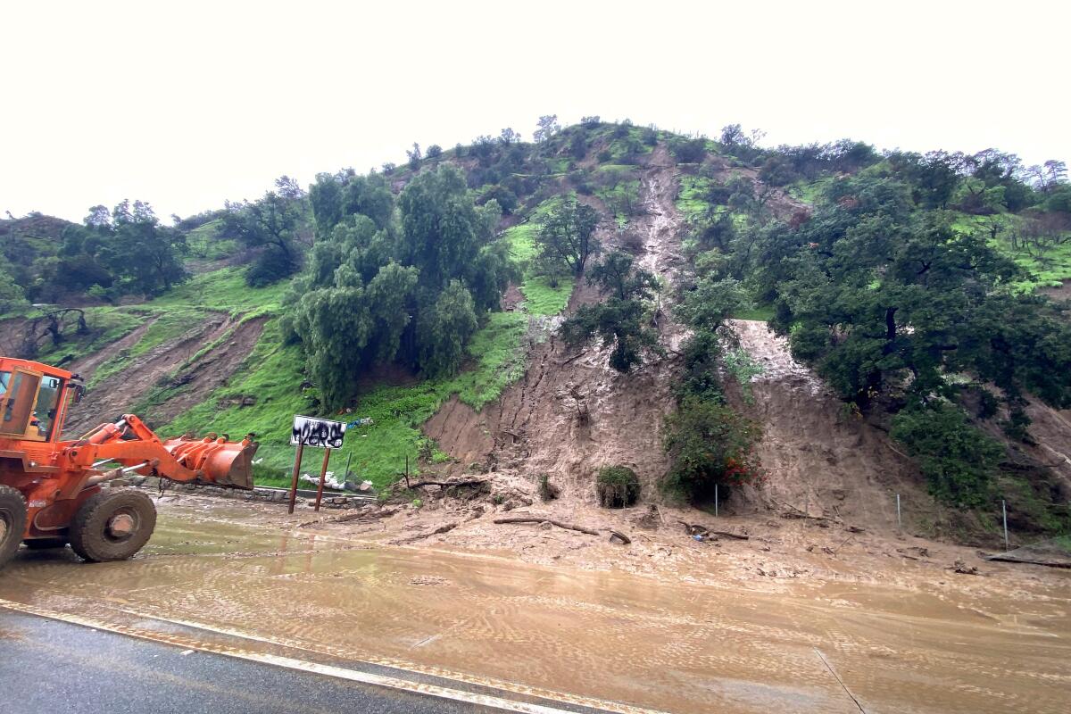 A mudflow spilled onto the 5 Freeway connector south of downtown Los Angeles in Elysian Park 