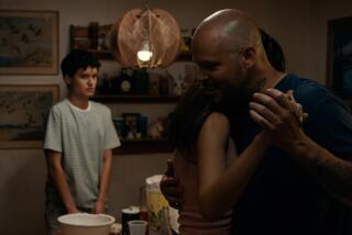 A father dances in his kitchen.