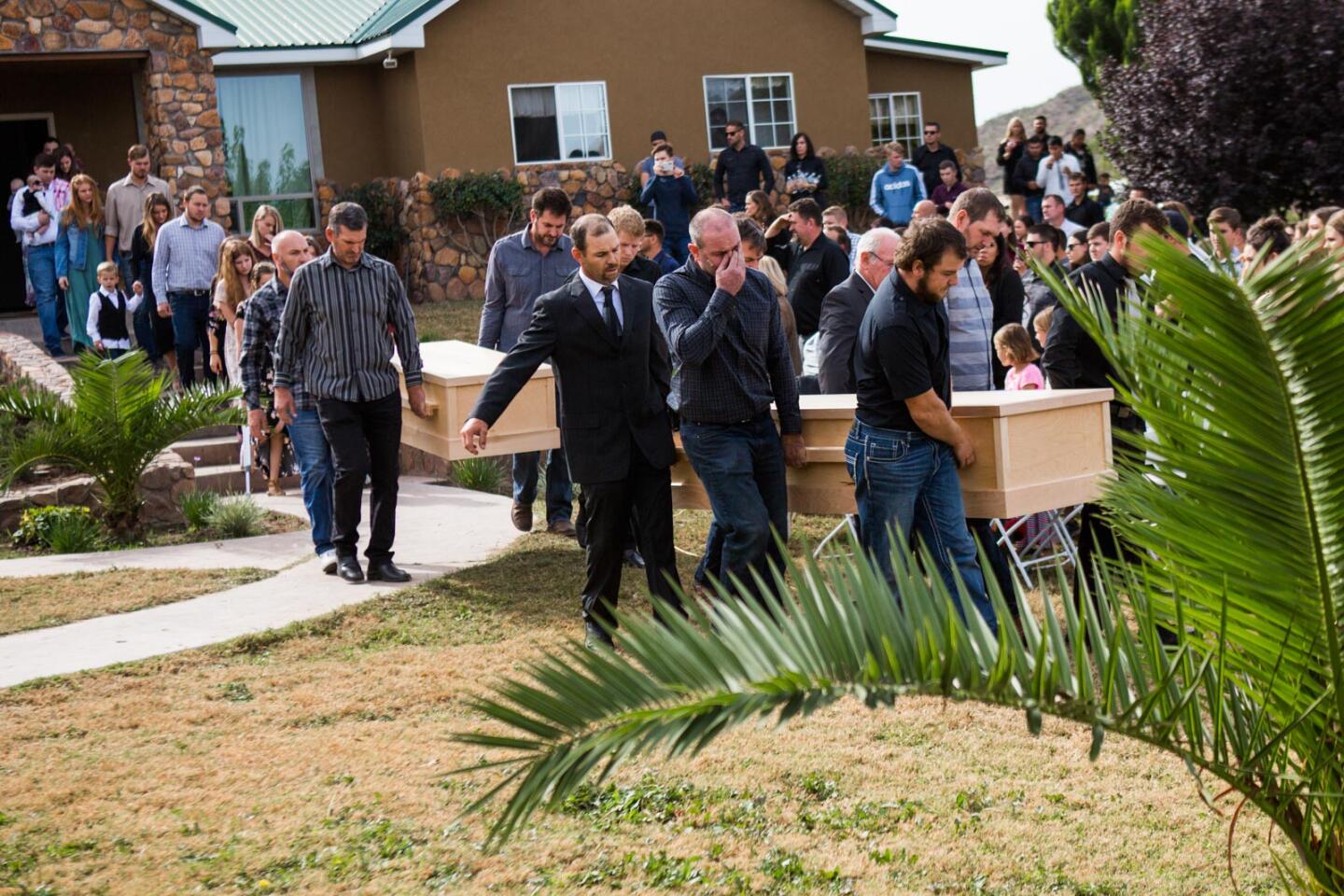 The coffins of Dawna Langford and two of her sons, Trevor and Rogan, are carried out for their funeral Thursday in La Mora, Mexico, Thursday, Nov. 7, 2019. The three were among the nine Mormons killed in Monday's attack.