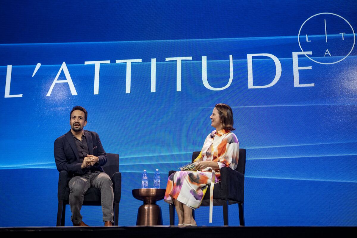 Lin-Manuel Miranda and American Express Group President Anna Marrs speak at the L'Attitude conference.