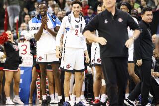 Spokane, WA - March 24: San Diego State guard Miles Byrd (21), center, and teammates smile on the bench during the second round of the NCAA Tournament against Yale at Spokane Veterans Memorial Arena on Sunday, March 24, 2024 in Spokane, WA. (Meg McLaughlin / The San Diego Union-Tribune)