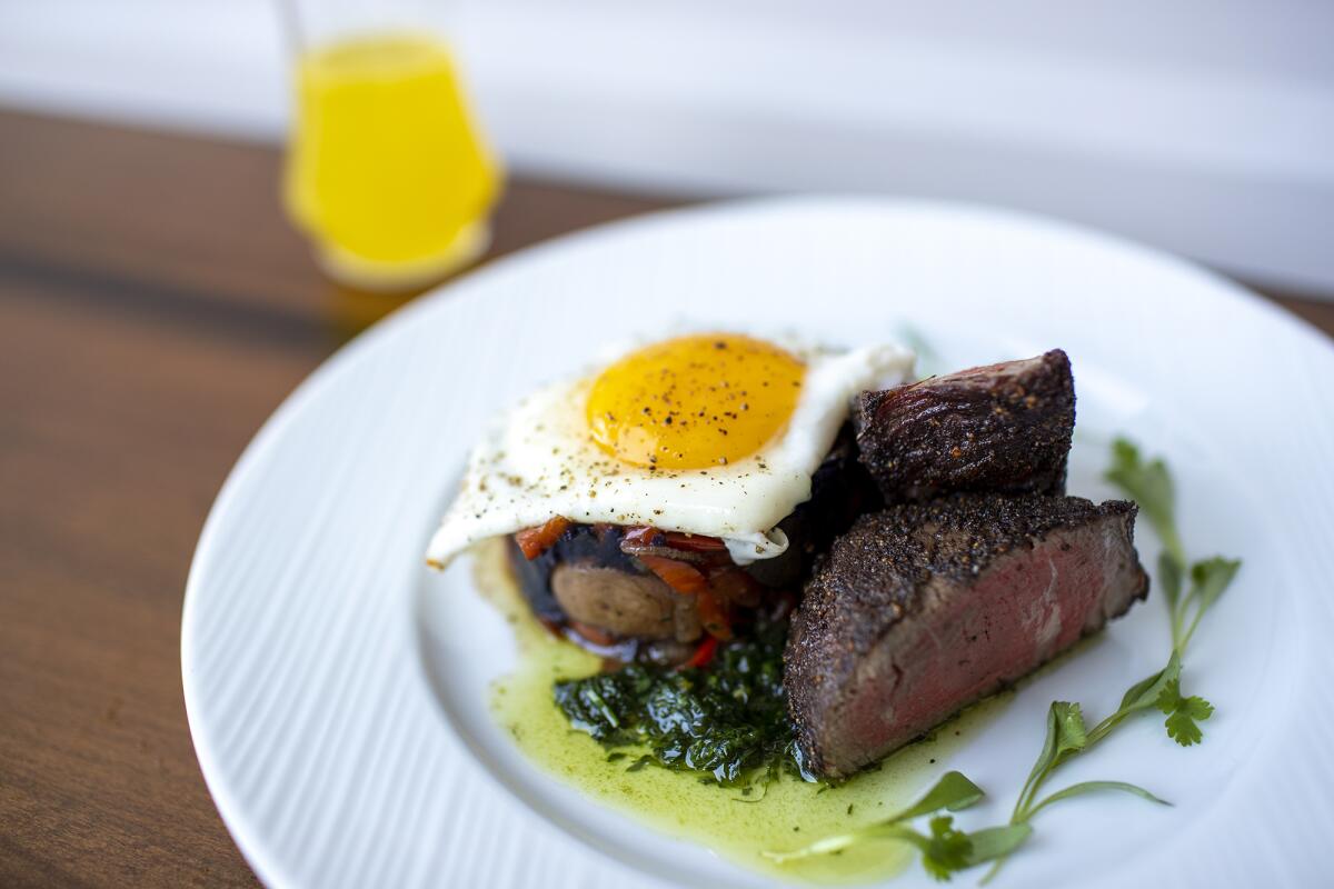The filet mignon with chimichurri, fried egg and duck fat potatoes from Paragon Cafe.