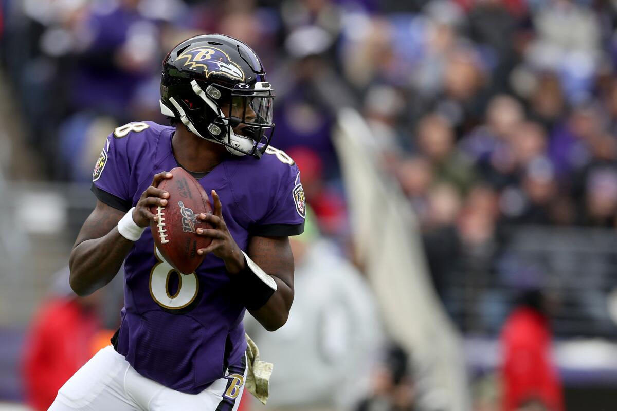 Ravens quarterback Lamar Jackson looks to pass during a game against the Texans on Nov. 17 at M&T Bank Stadium. 
