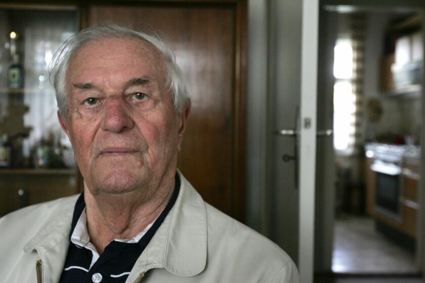 A picture taken on 2 May 2005 shows Rochus Misch, former staff sergeant in the Nazi SS with responsibility for maintaining the telephone lines in the bunker of Nazi Party's leader Austrian-born German Adolf Hitler, sitting in his home in Berlin. Misch, who served as Hitler's devoted bodyguard for most of World War II and was the last remaining witness to the Nazi leader's final hours in his Berlin bunker, died on September 5, 2013 in the age of 96.