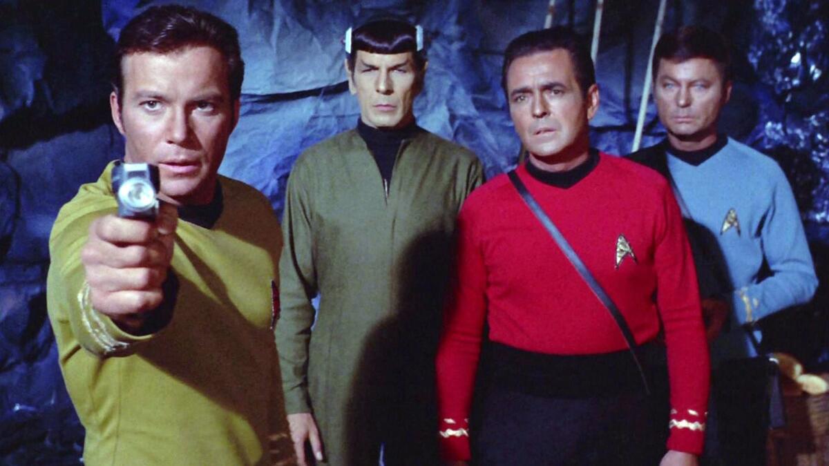 William Shatner as Capt. James T. Kirk, left, with Leonard Nimoy as Mr. Spock, James Doohan as Montgomery "Scotty" Scott and DeForest Kelley as Dr. Leonard "Bones" McCoy in the original "Star Trek" TV series.