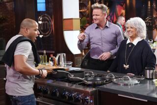 A contestant cooks for Gordon Ramsay, center, and Paula Dean in "MasterChef" on Fox.