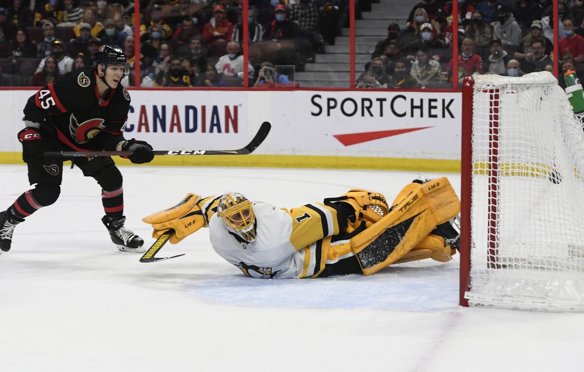 Ottawa Senators' Parker Kelly (45) scores past Pittsburgh Penguins goaltender Casey DeSmith (1) for a goal during the second period of an NHL hockey game in Ottawa, on Saturday, Nov. 13, 2021. (Justin Tang/The Canadian Press via AP)