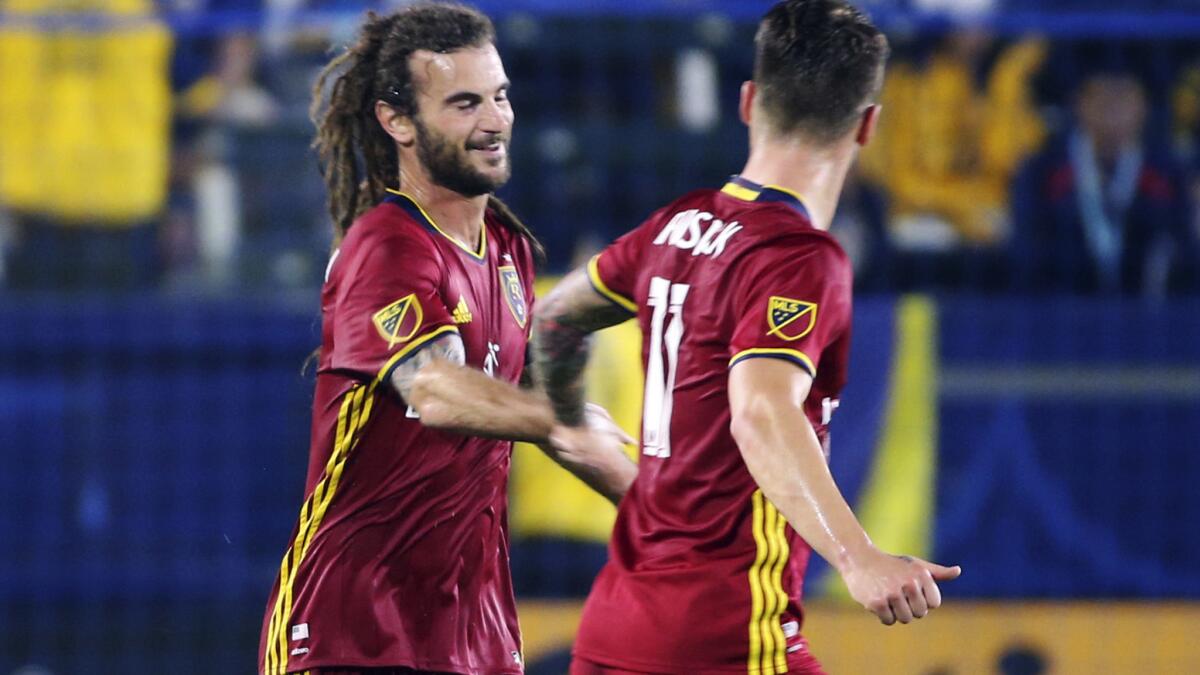 Real Salt Lake midfielder Kyle Beckerman, left, is congratulated by teammate Albert Rusnak after scoring a goal against the Galaxy in the first half Tuesday night.