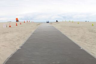 New wheelchair accessible beach mats at Coronado's Central Beach. The mats lead down to the shore from the lifeguard tower. They were installed May 9, 2019.