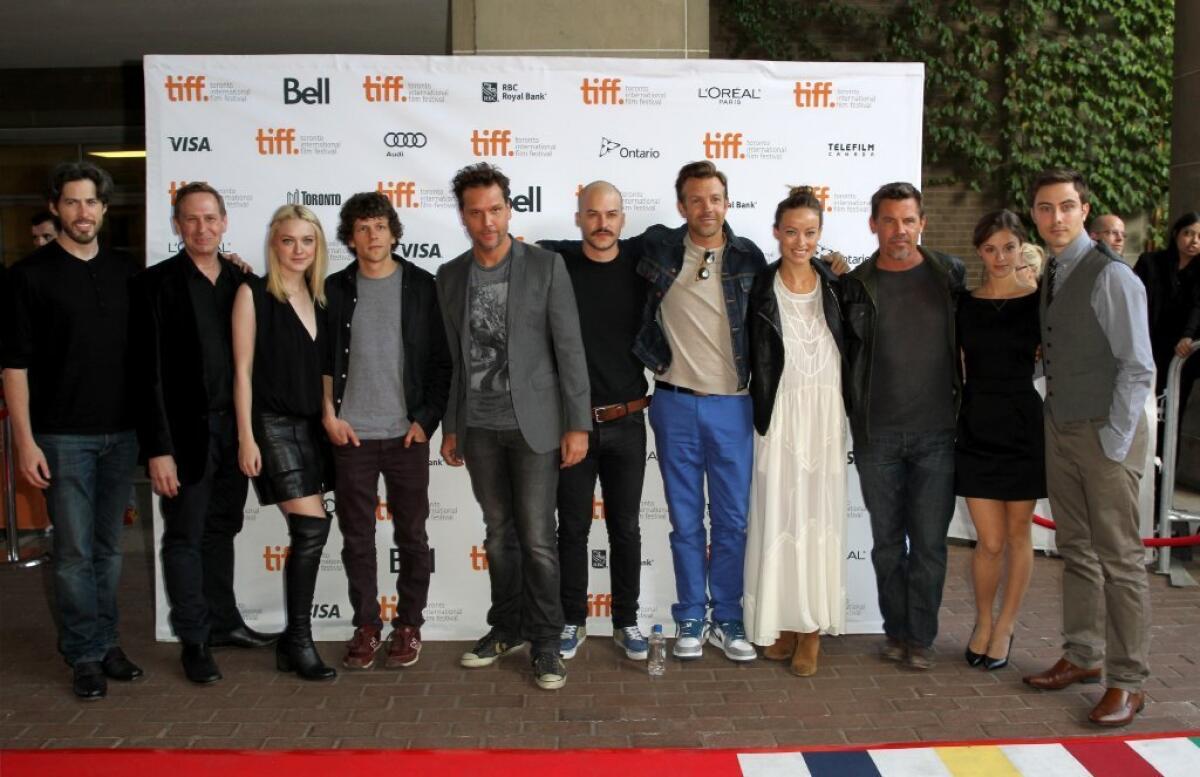 Director Jason Reitman, from left, and actors Scott Thompson, Dakota Fanning, Jesse Eisenberg, Dane Cook, Marc-Andre Grondin, Jason Sudeikis, Olivia Wilde, Josh Brolin, Jordan Hayes and Jarod Einsohn at the live read of "Boogie Nights" at the Toronto International Film Festival.