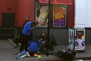 San Francisco, CA - A group of men loiter and use drugs outside a fastfood restaurant in the Tenderloin district of San Francisco. The Tenderloin is a high crime area known for open sales and use of illegal drugs as well thousands of unhoused living on the streets. One of the world's premier cities, San Francisco now has a dubious reputation for intractable homelessness, rampant crime and an exodus of business. (Luis Sinco / Los Angeles Times)