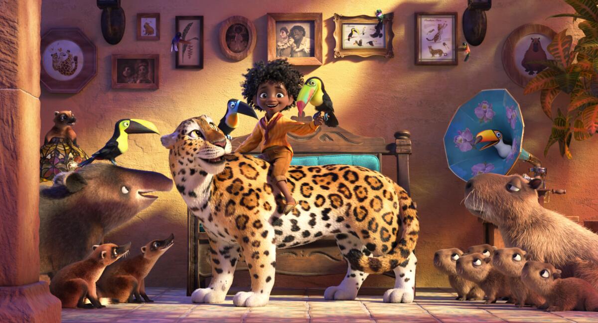 a boy riding a jaguar surrounded by other animals