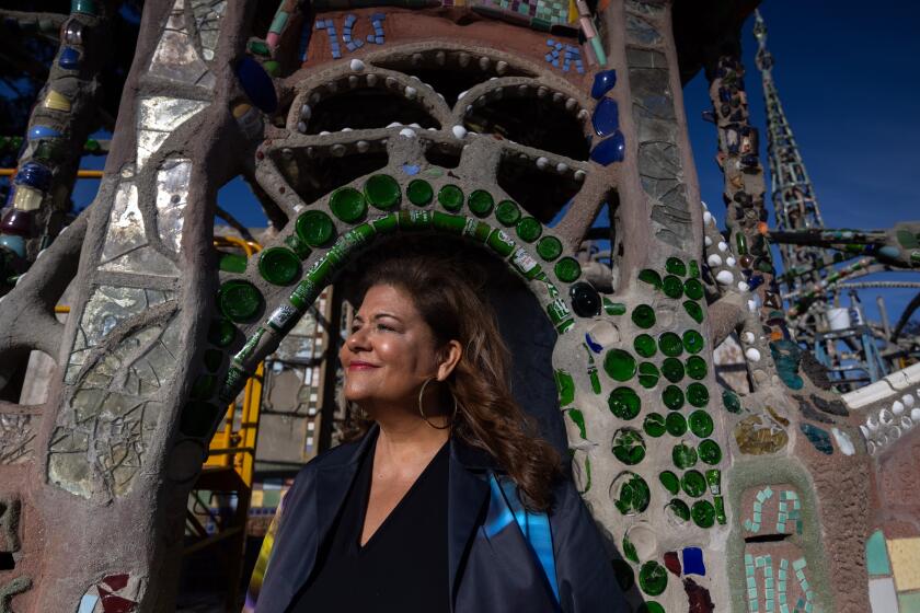 Elizabeth Alexander, a Black woman, is seen smiling into the sun as her head and torso are framed by a mosaic arch.