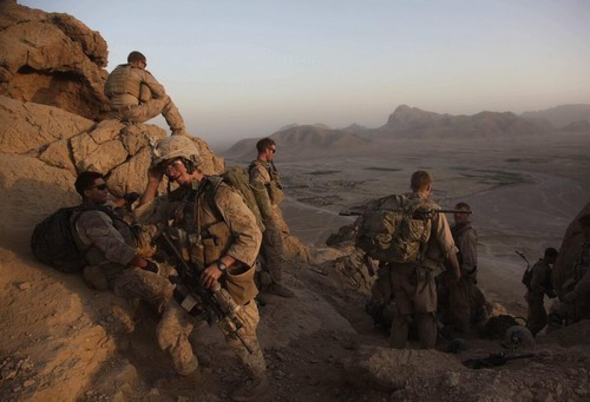 Lance Cpl. Mark Chieffallo of Pittsburg arrives at an observation post on a peak above a village in Helmand province with over Marines.