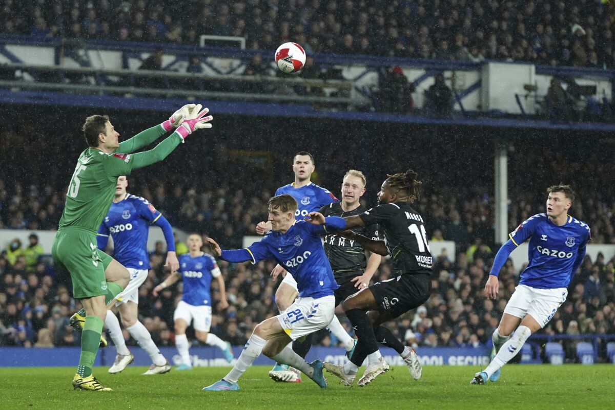 Everton's goalkeeper Asmir Begovic claims the ball during the English FA Cup 5th round soccer match between Everton and Boreham Wood at Goodison Park in Liverpool, England, Thursday, March 3, 2022. (AP Photo/Jon Super)