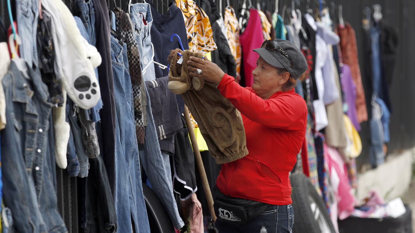 Carmen Salinas sells items at 83rd and Figueroa streets in Los Angeles.