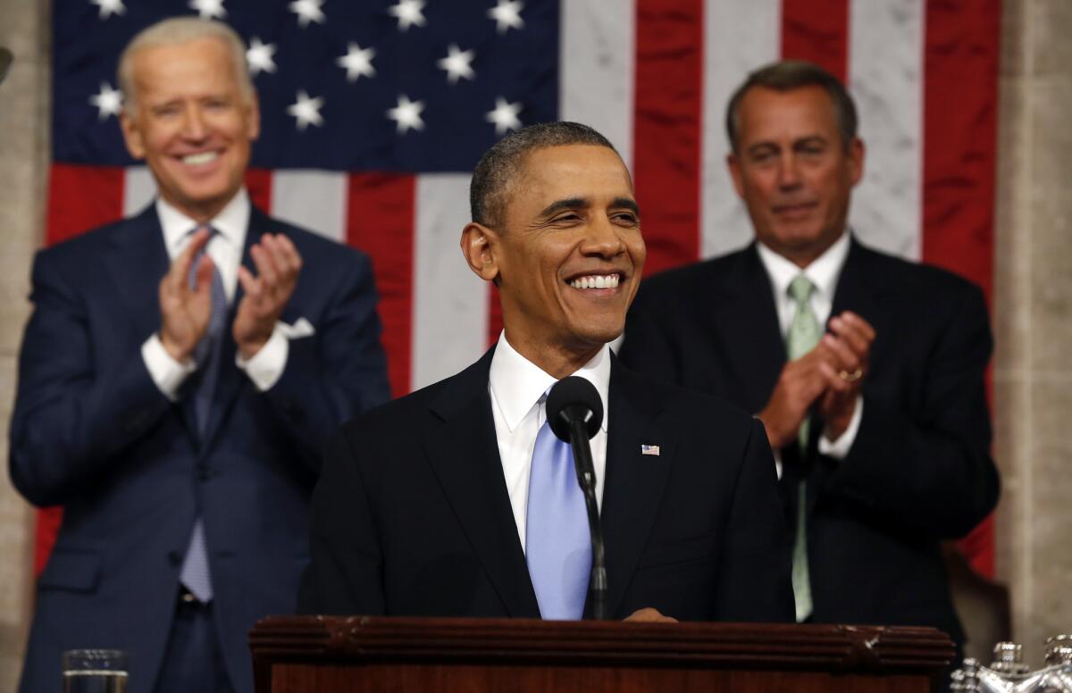President Obama delivers the State of Union address before a joint session of Congress in the House chamber in Washington as Vice President Joe Biden and House Speaker John Boehner of Ohio applaud.
